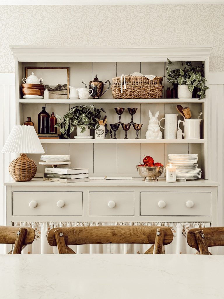 Fall home decor ideas with tarnished silver, baskets, fall scented candles, and apples.