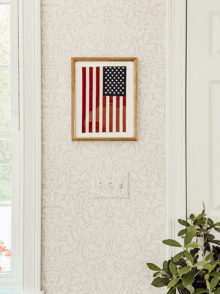 DIY American flag wall art using a new flag and black tea to make it look vintage.