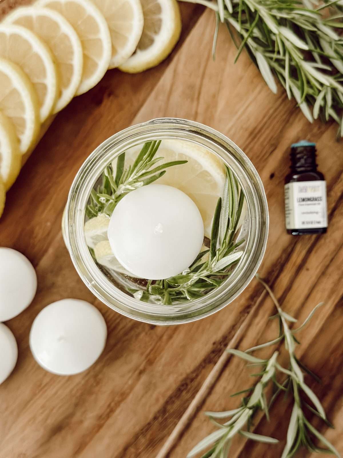 DIY rosemary and lemon citronella candles to keep the bugs away outside.