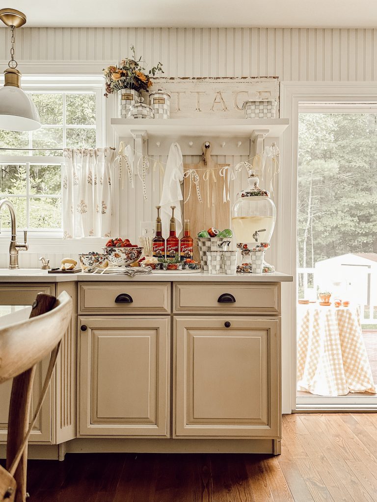 Everything you need to create an indoor lemonade bar including garnishes, drink dispenser, and flavored syrups.