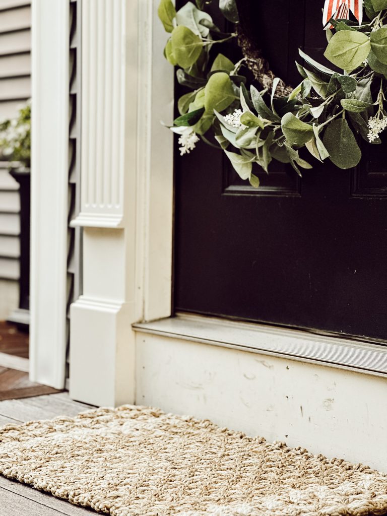 Beautiful by Drew Barrymore jute doormat at front door.