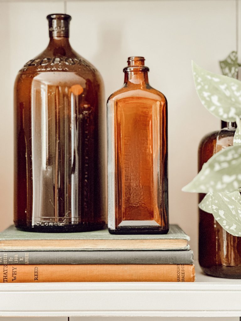 Vintage amber glass bottles are a great way to add warm fall colors to your decor.