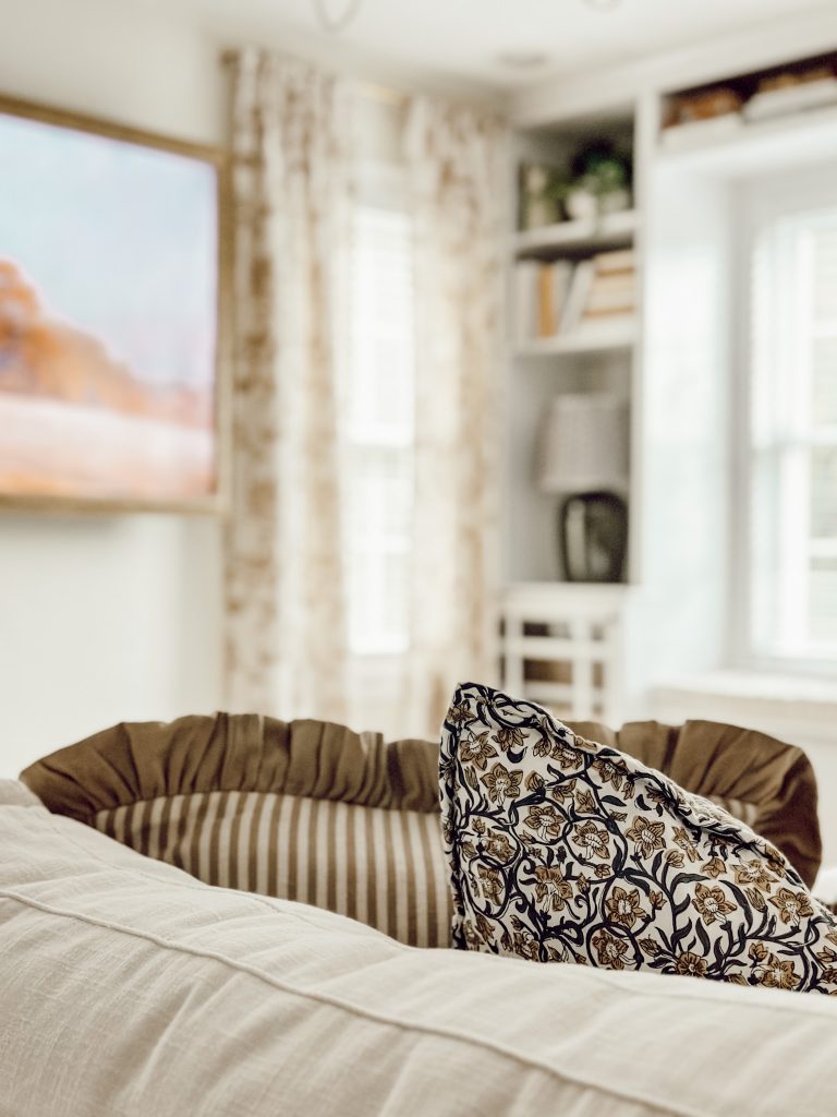 Mix fall patterns on living room couch to add texture and depth to your autumn decorations.