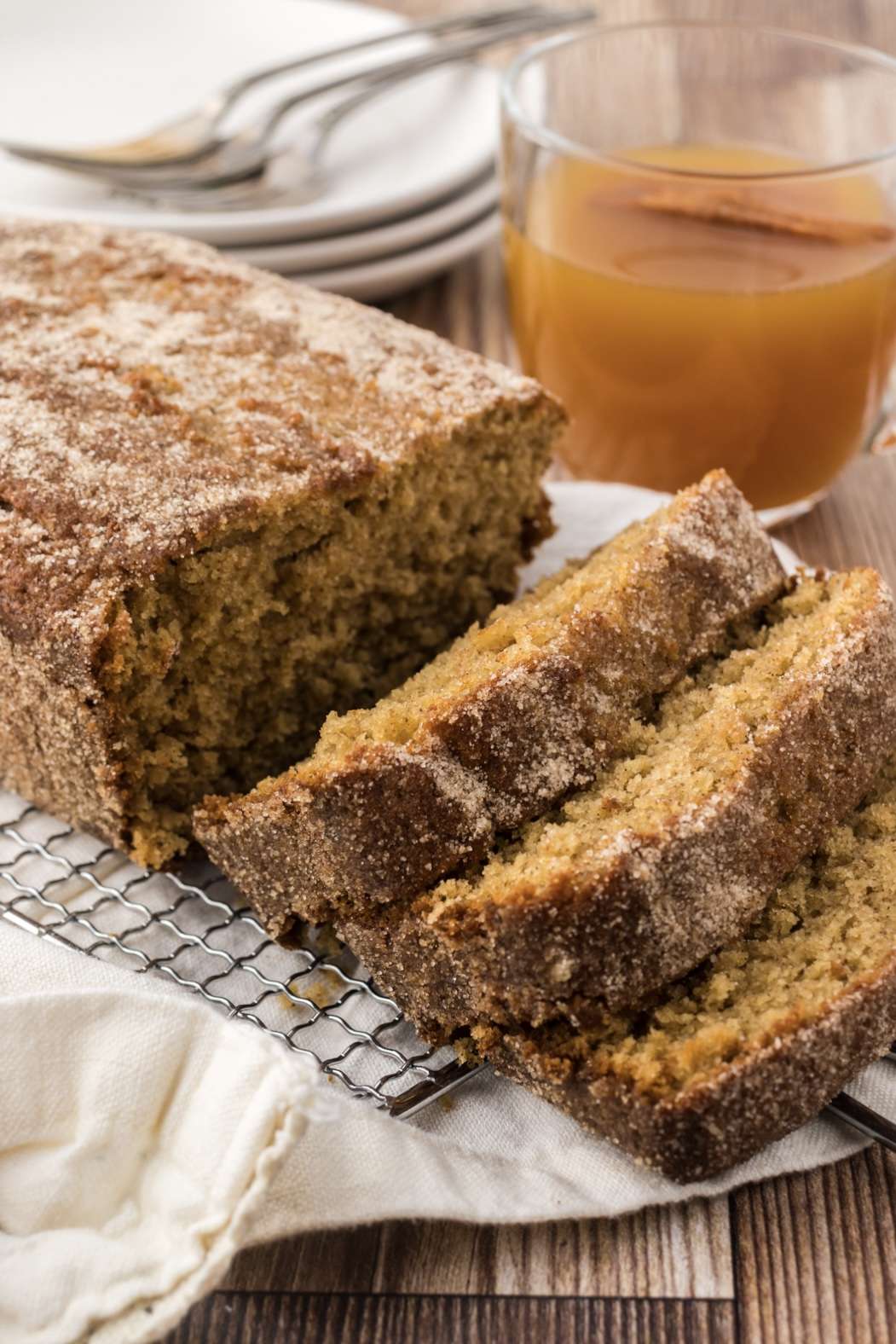 Apple cider doughnut loaf cake with a cinnamon sugar coating for crunch.