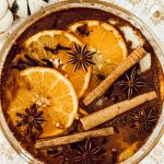 Small pot filled with fresh fruit, spices, and vanilla extract to simmer on the stove for seasonal scents.