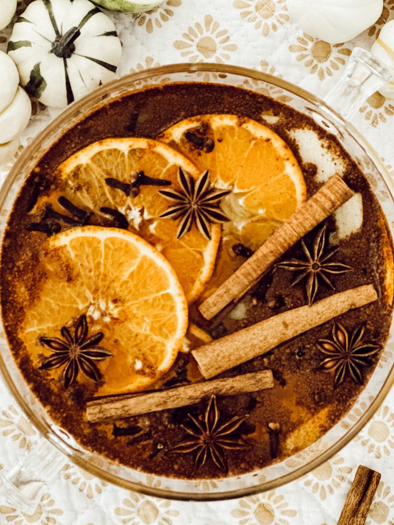 Small pot filled with fresh fruit, spices, and vanilla extract to simmer on the stove for seasonal scents.