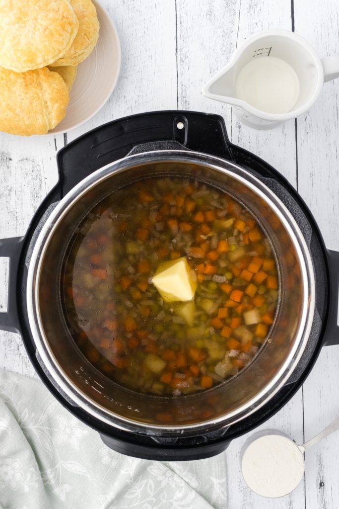 Chicken pot pie in electric pressure cooker for a cozy dinner with puff pastry toppers.