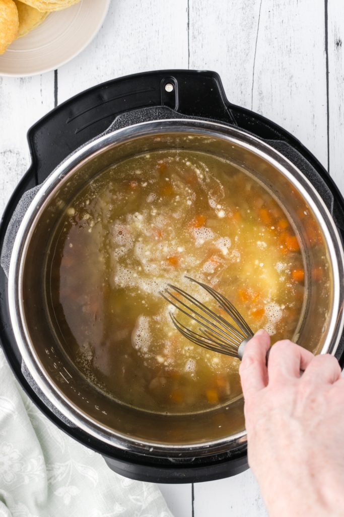 Instant pot recipe with chicken breasts, frozen vegetables, and gravy.