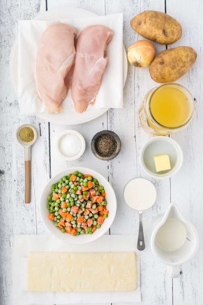 The main ingredients you'll need to make homemade chicken pie include chicken breasts, potatoes, peas & corn, milk, flour, butter, chicken stock, and seasonings.