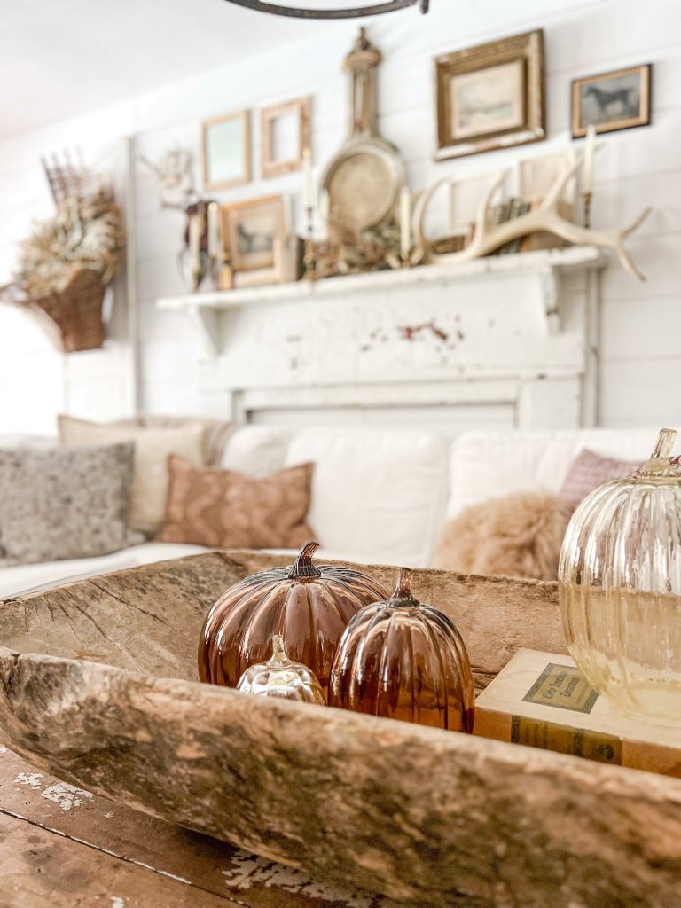 Cozy fall living room with pumpkins and thrifted pieces from Robyn's French Nest.