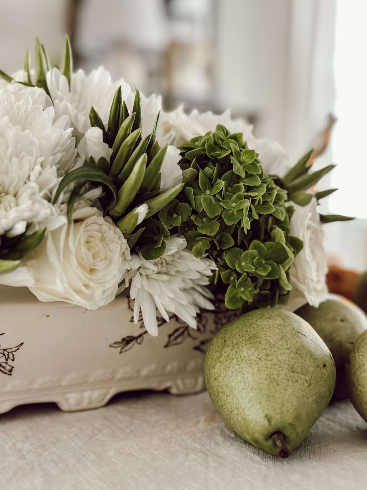 Vintage soup tureen with fresh flowers to create a Thanksgiving centerpiece for the Thanksgiving table.
