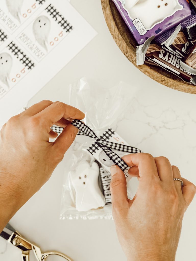Tie the Halloween treat bag closed with a seasonal ribbon for a festive touch.