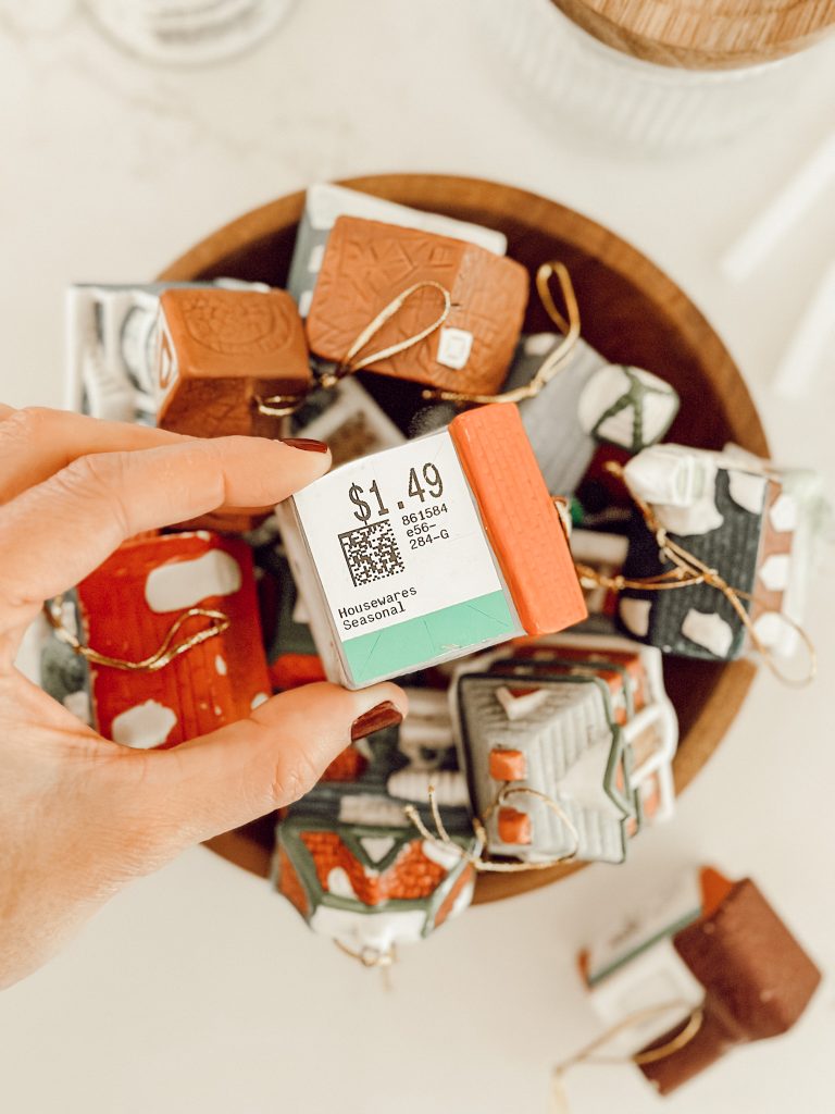 Miniature house Christmas ornaments will be transformed into treat jar toppers.