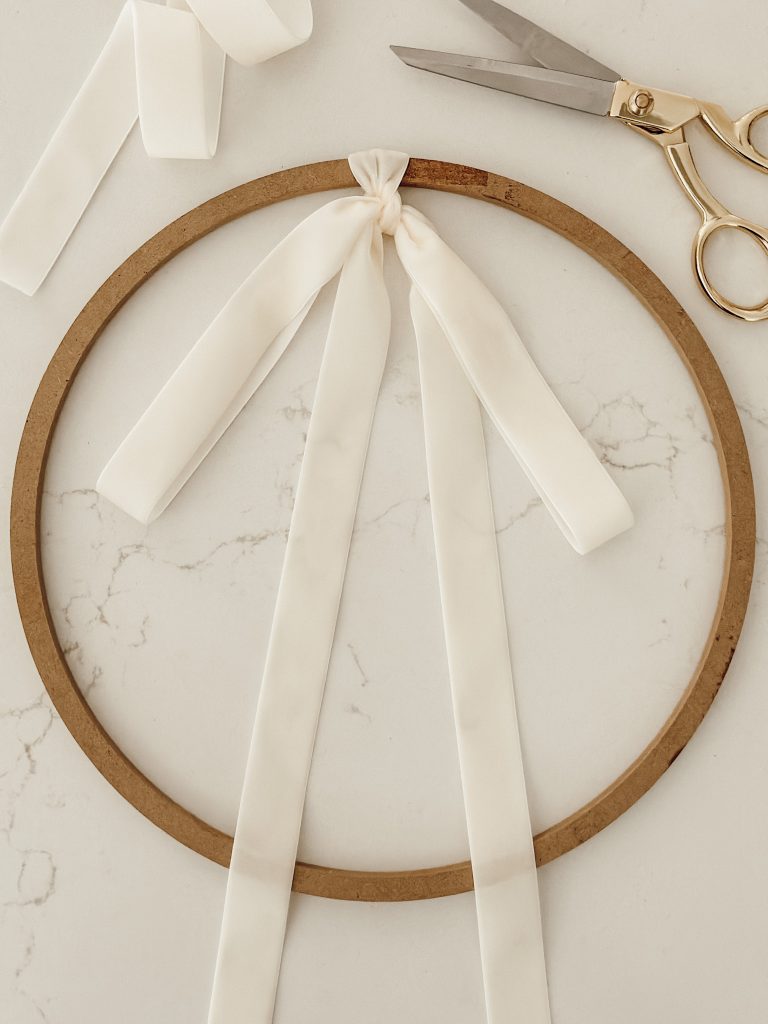 Velvet ribbon tied on wreath ring for a beautiful fall wreath in our home decor.
