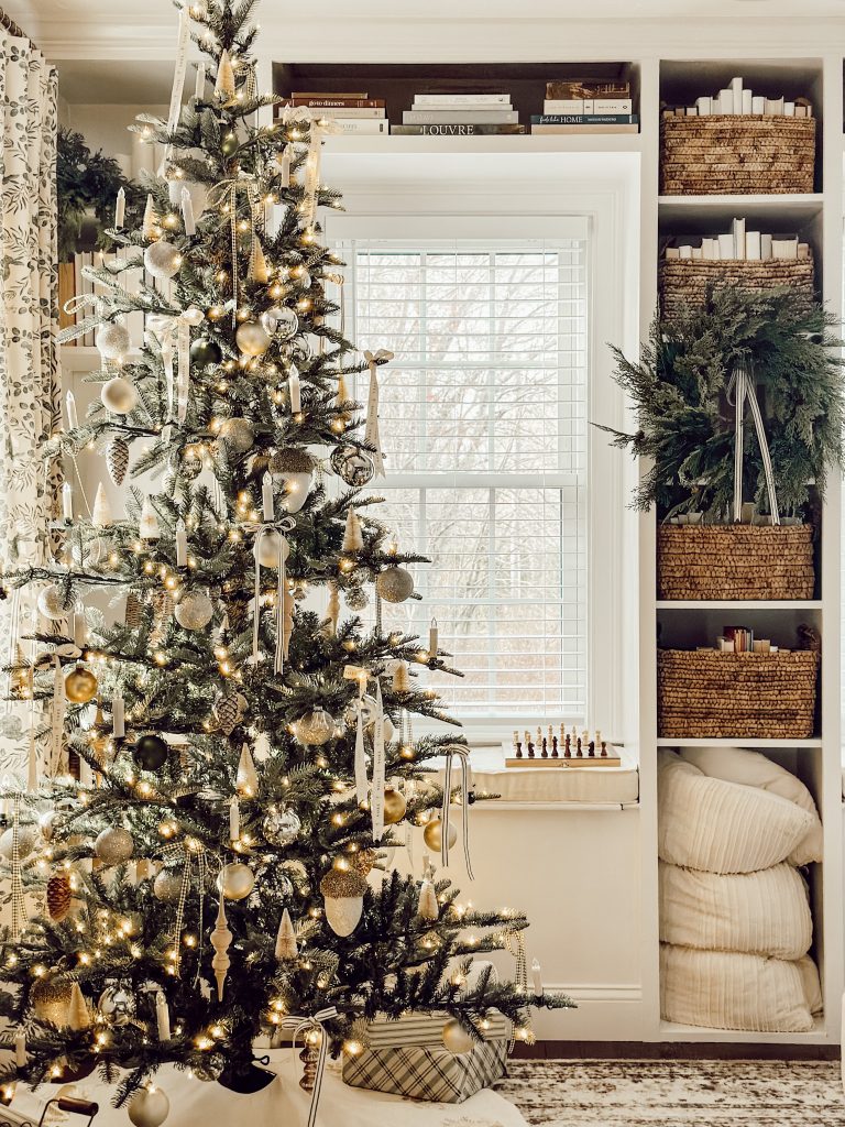 Christmas tree in the living room with Christmas gifts underneath.
