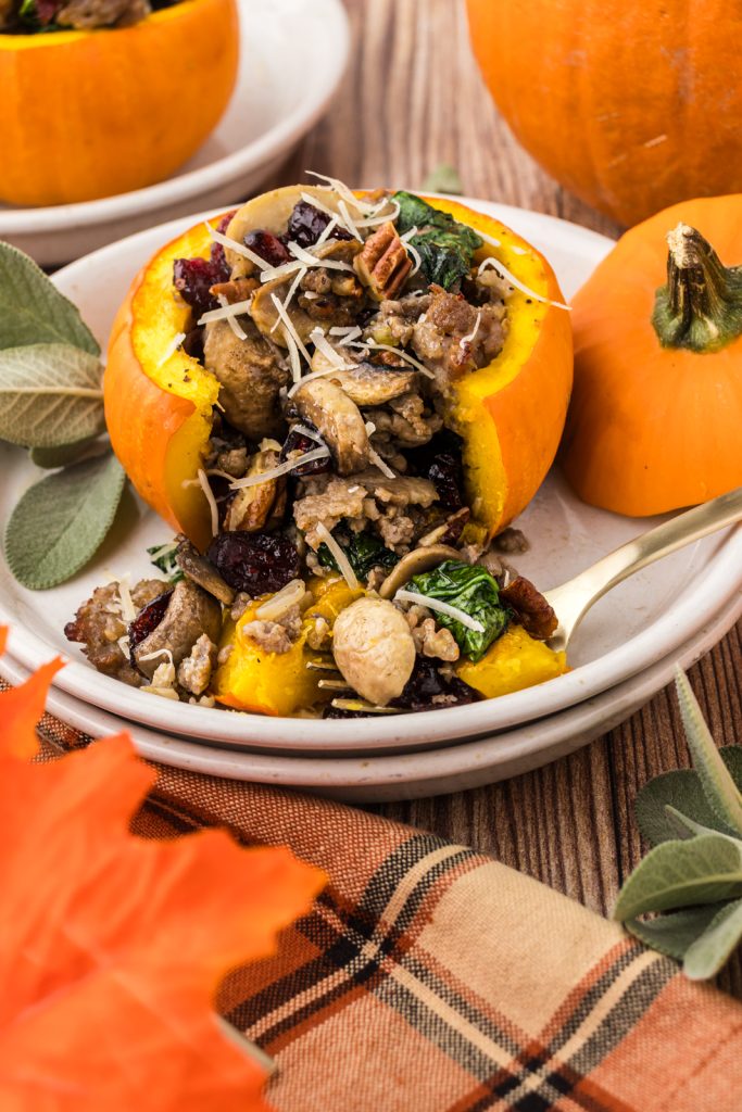 Sausage mixture stuffed inside a small pumpkin and roasted in an oven for a delicious fall dinner.