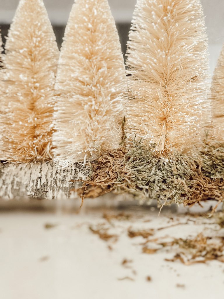 Add a festive touch to your dining room table or fireplace mantel with this unique Christmas centerpiece.