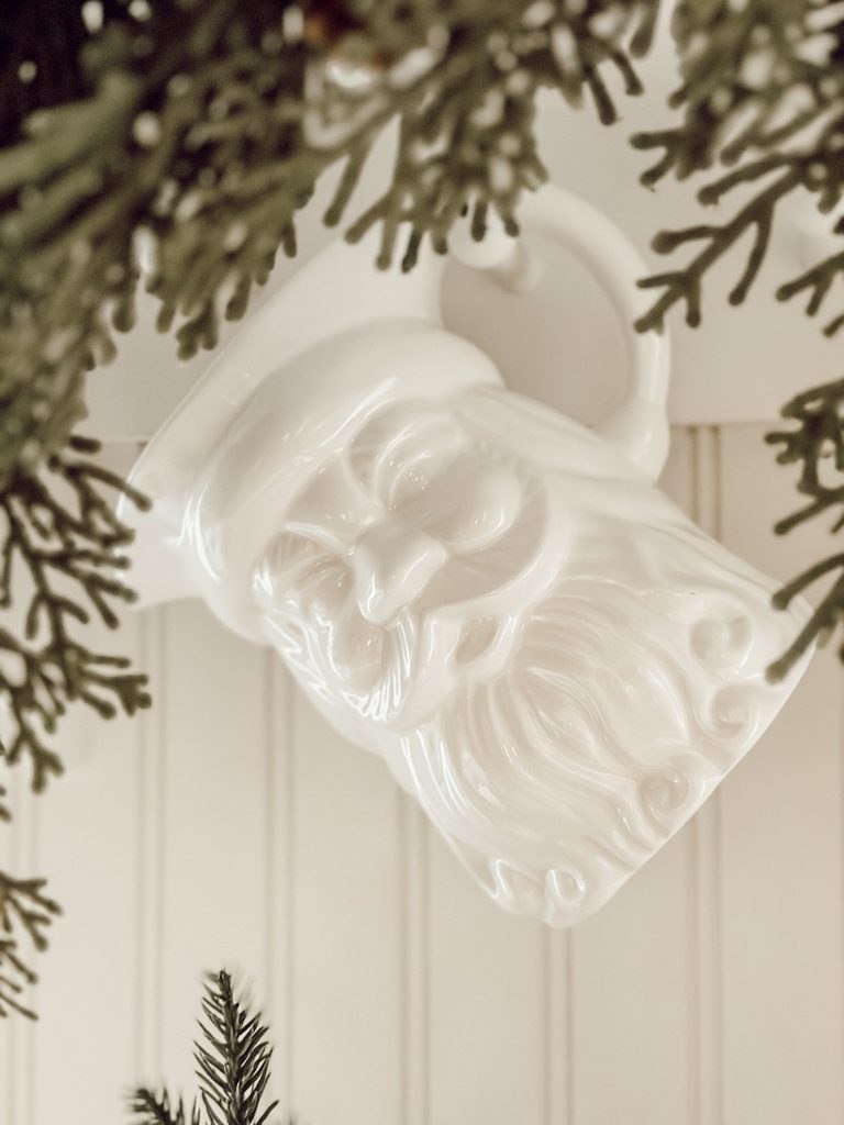 White Santa ceramic pitcher in nostalgic Christmas decor.