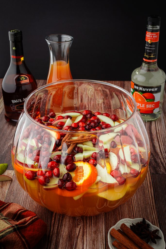 White wine sangria with fresh cranberries, apple slices, oranges, and pears.