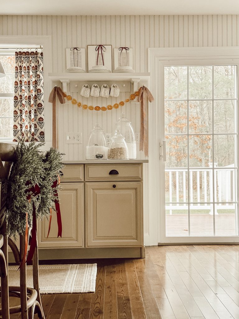 Christmas decorations in the kitchen with simple satin ribbons to add festive cheer.