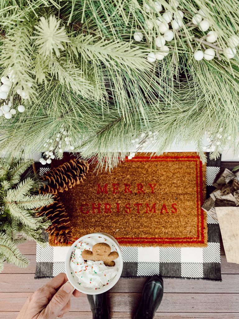 Evergreen Christmas wreath on hanging on the front door of our home.