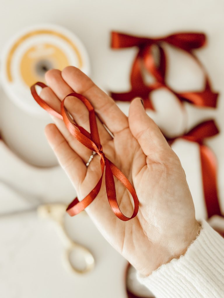 Thin satin ribbon tied into a bow for the Christmas tree.