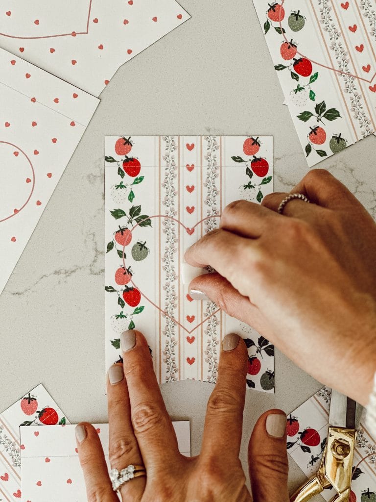 Place the foam sticker in the middle of the Valentine pennant to attach the heart shape.