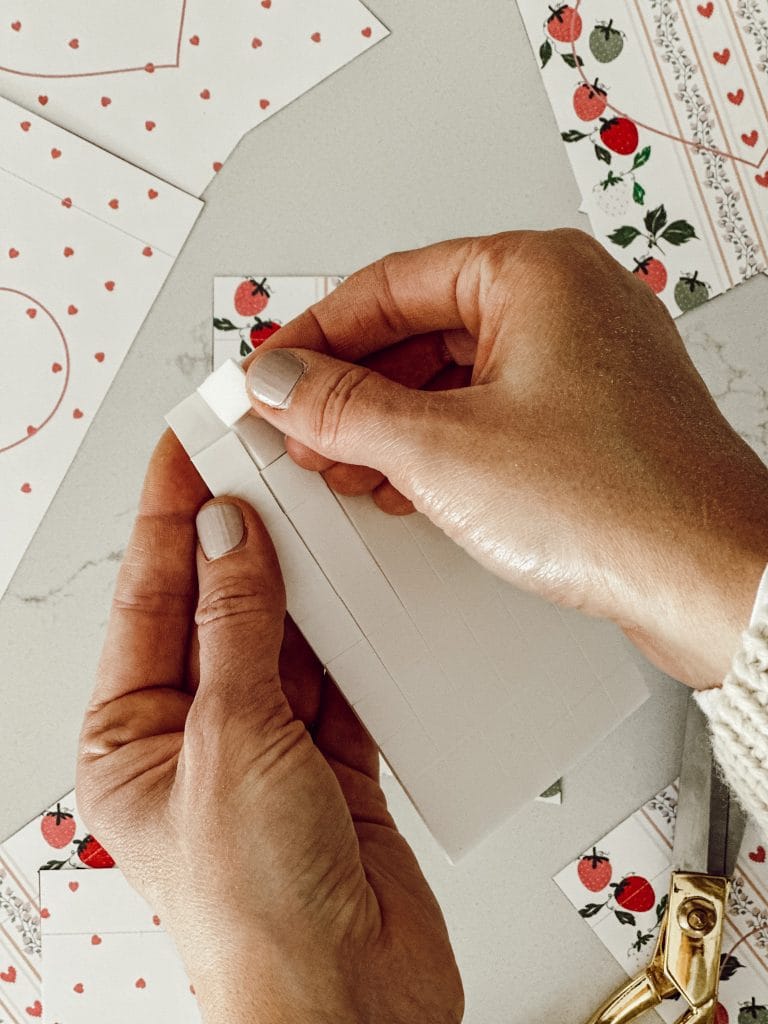 Peel the foam sticker off the backing to attach it to the Valentine pennant.