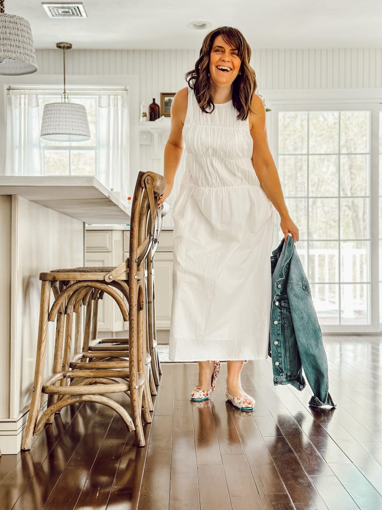 Floral Tieks footwear with a white midi dress and a denim jacket.