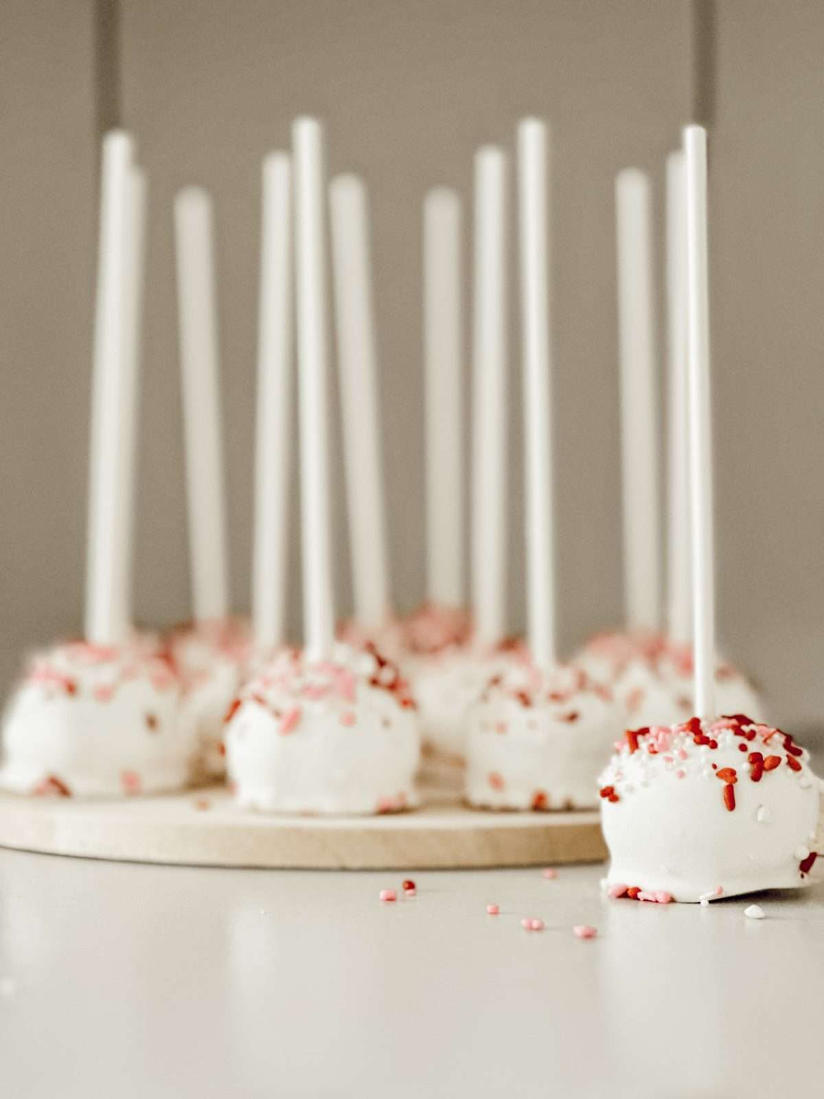 No bake snack cake pops with sprinkles made with Little Debbie snack cakes for Valentine's Day.