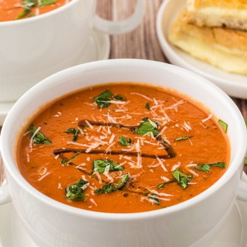 Olive oil, parmesan cheese, and parsley garnish for delicious soup.