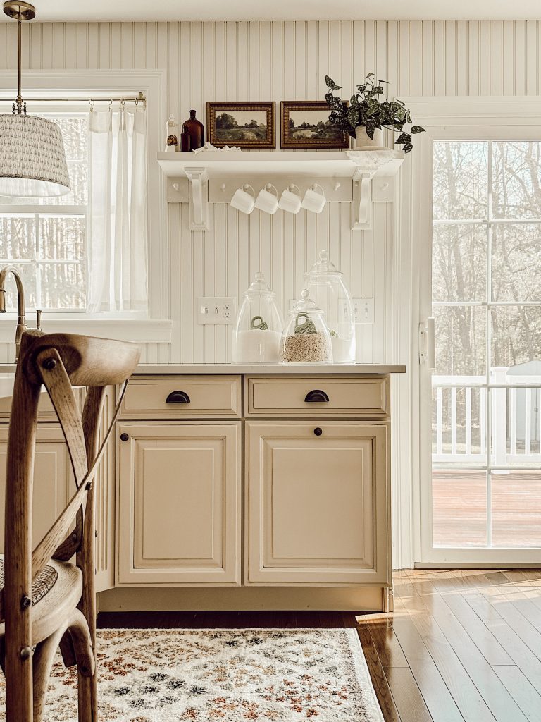 Open shelving in the kitchen decorated with seasonal decor.