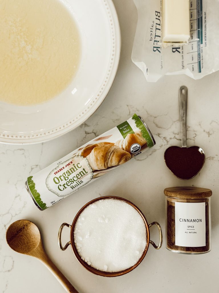 You'll need melted butter, a can of crescent rolls, granulated sugar, and ground cinnamon to make homemade churros.