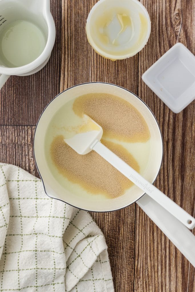 Using a spatula or wooden spoon stir the instant yeast into the buttermilk mixture.