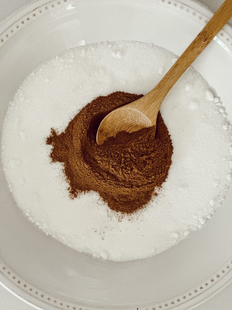 Combine a tablespoon of cinnamon with a cup of granulated sugar to make the cinnamon sugar churro topping.