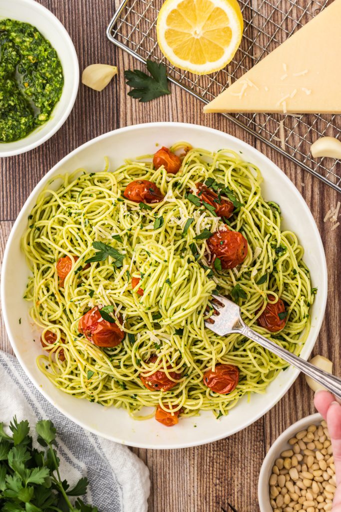 Family favorite angel hair pasta dish with pasta sauce and roasted cherry tomatoes.