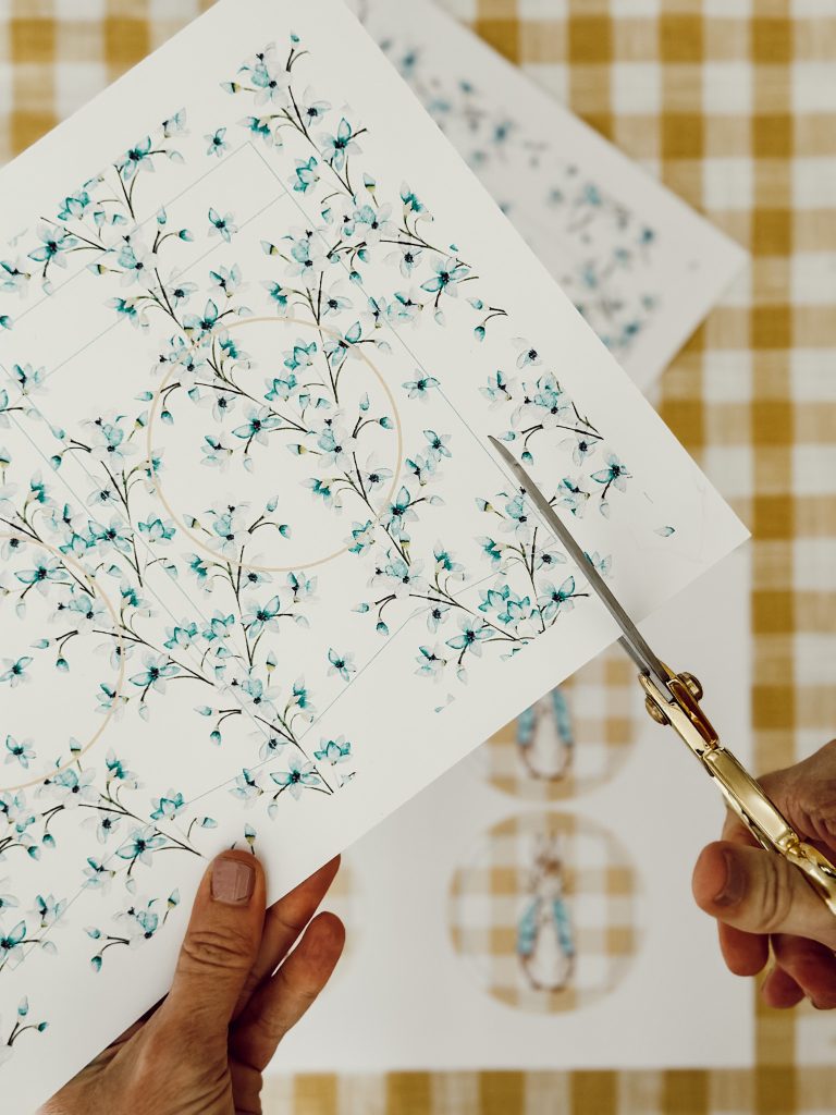 Use sharp scissors to cut out the printed design on the cardstock to begin building the paper pennant garland.