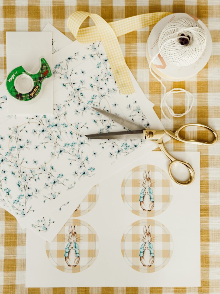 Printed cardstock, scissors, twine, ribbon, tape, and foam stickers are all you need for this easy DIY project.