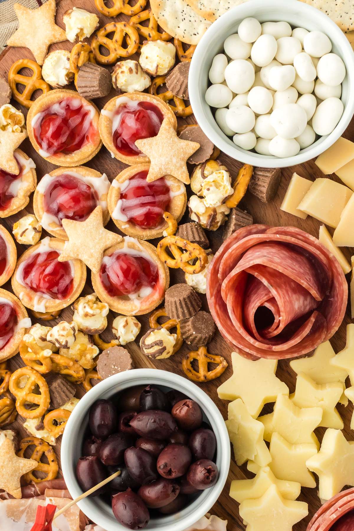 4th of July charcuterie board filled with sweet treats, cheeses, and meats. 