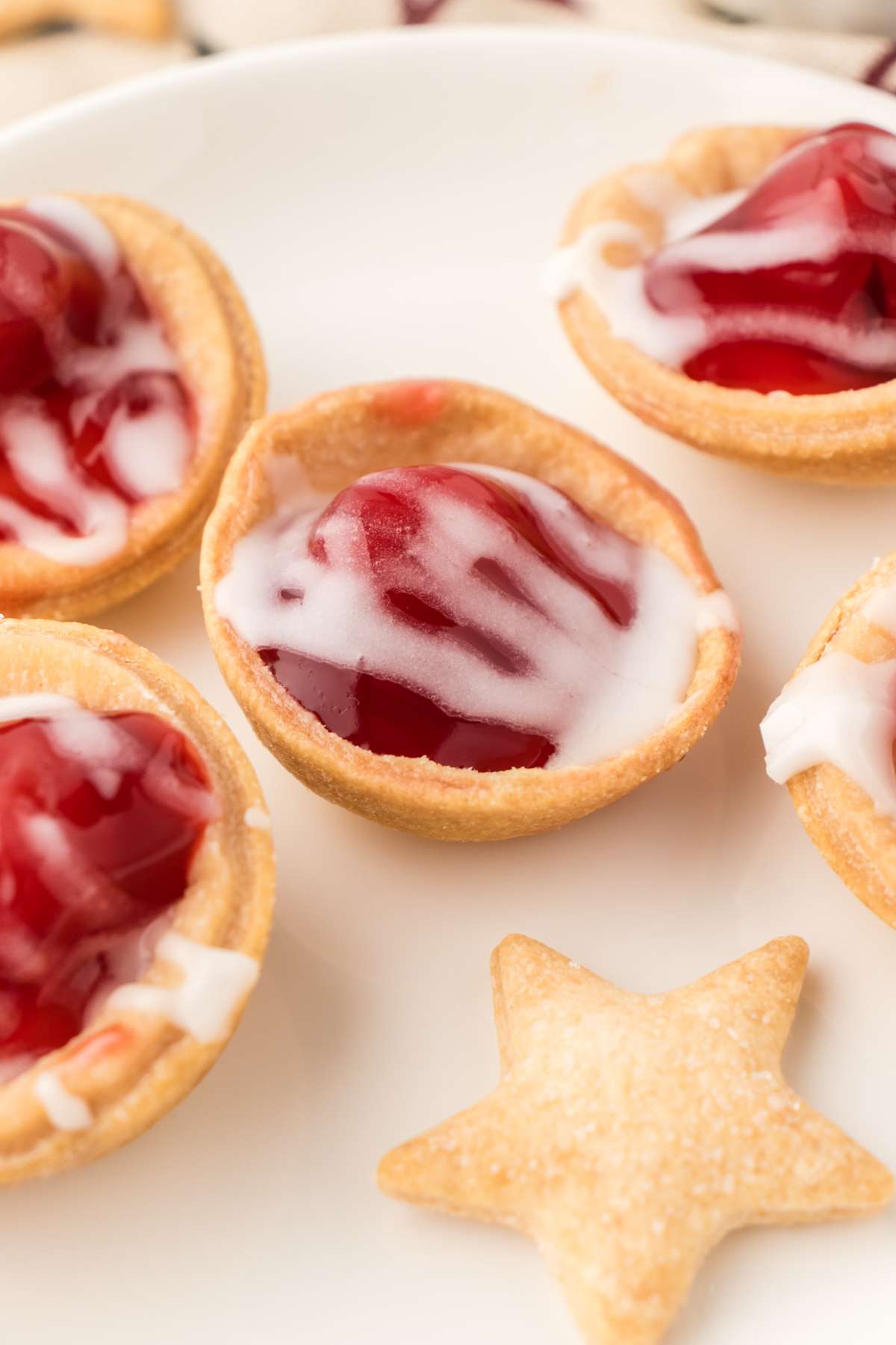 Mini cherry pie cups with store bought pie crust and canned pie filling.