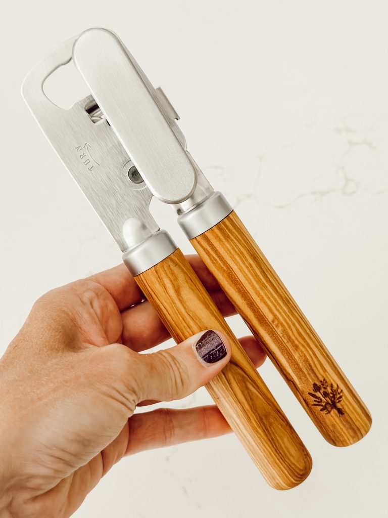 New Pioneer Woman manual can opener with olive wood handles in our cozy cottage kitchen.