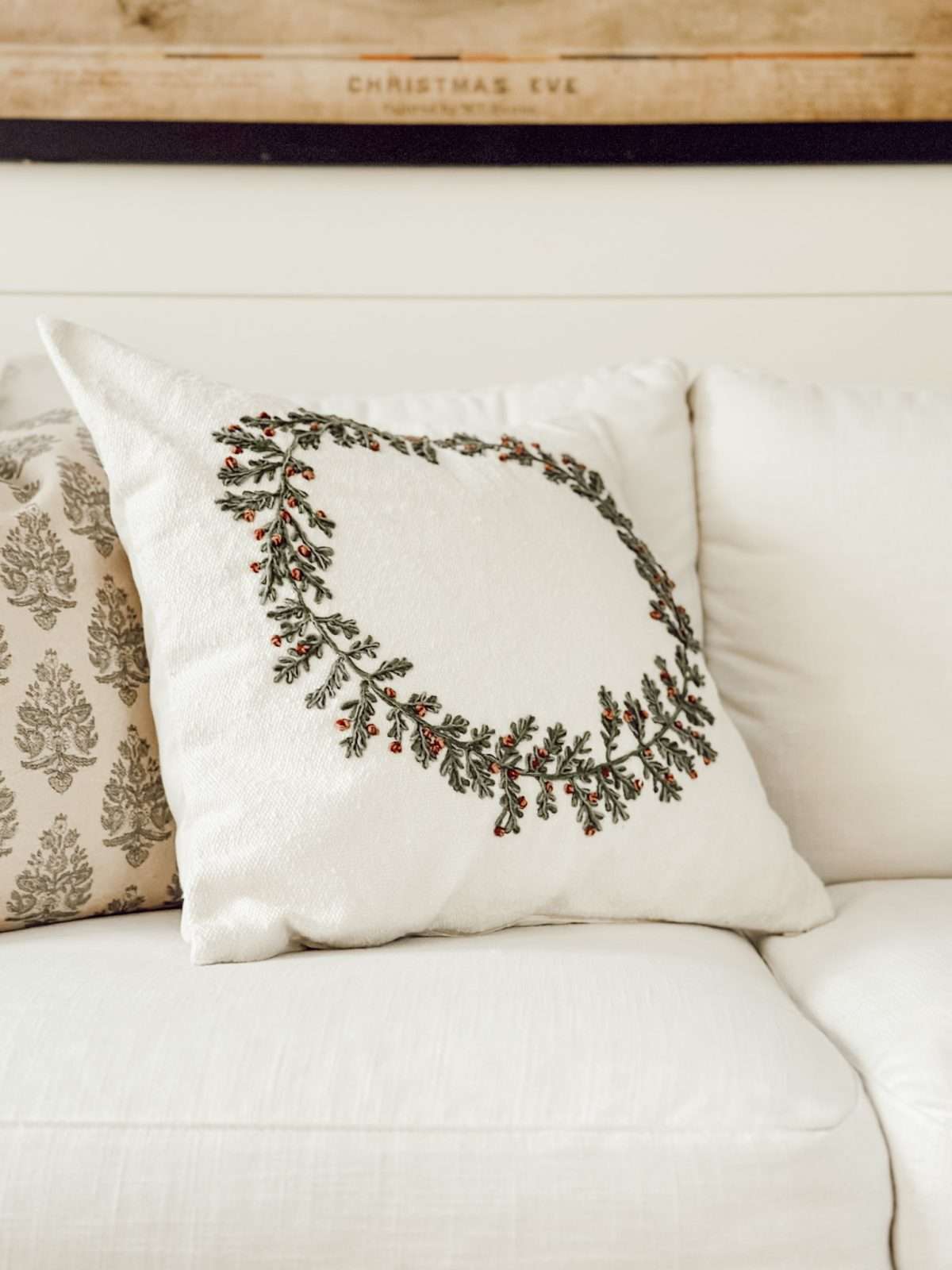 Weekly Wednesday Wish List #214 with Christmas throw pillows on a white living room couch.