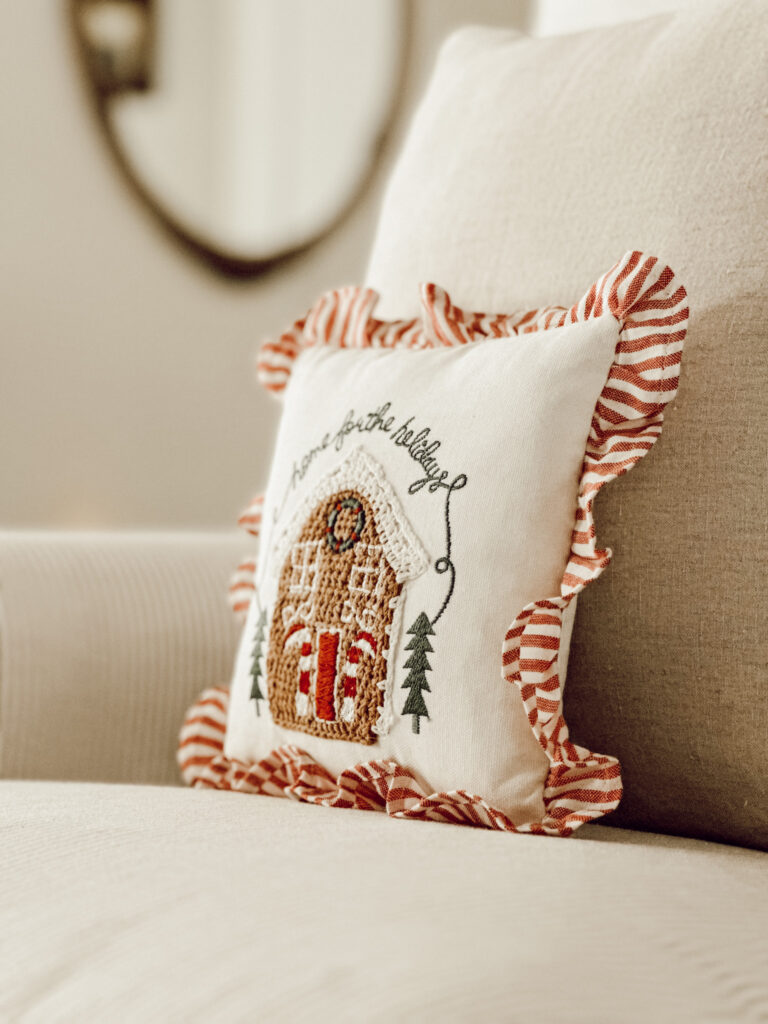 Christmas throw pillow on chair to add holiday decor to your home when you're ready to decorate.