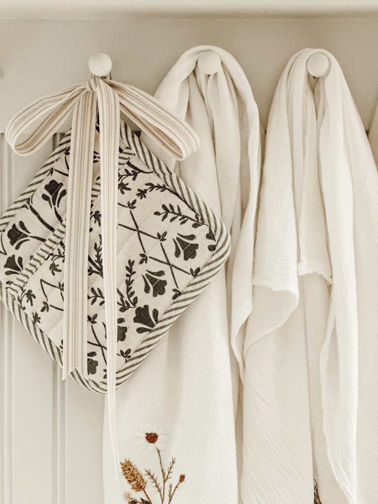 Coy fall textiles in the kitchen include a pot holder and linen cotton dish towels.