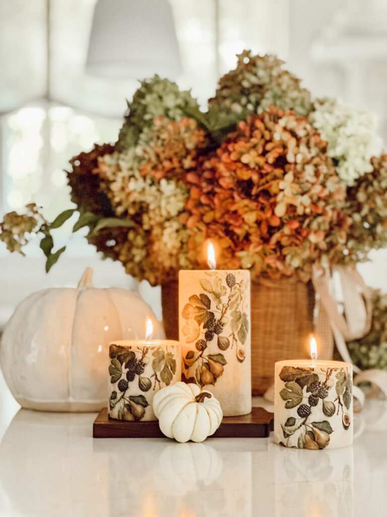 DIY candle project with paper napkins in the kitchen with fresh hydrangeas and pumpkins.