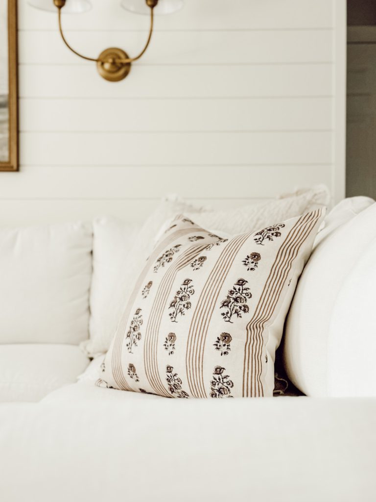 Free fall decor ideas include adding cozy throw pillows to your couch in the living room.