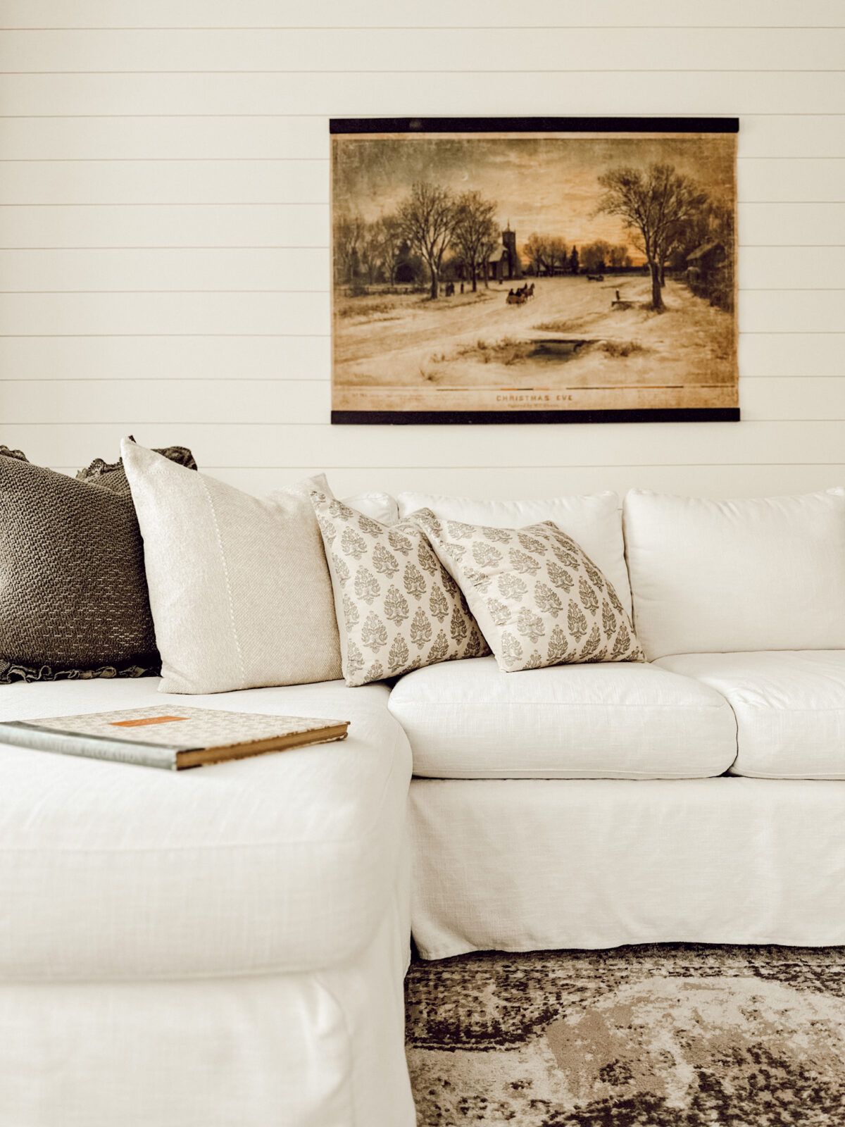 Magnolia 2025 Christmas decor collection with a Christmas Eve tapestry in neutral living room.