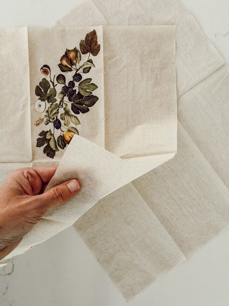 The paper napkin separated into two pieces to make custom candles.