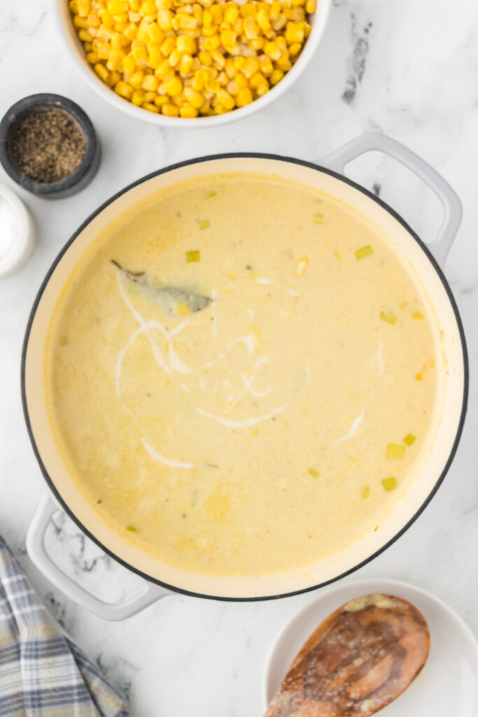Slurry poured in to soup pot to create a creamy corn chowder.