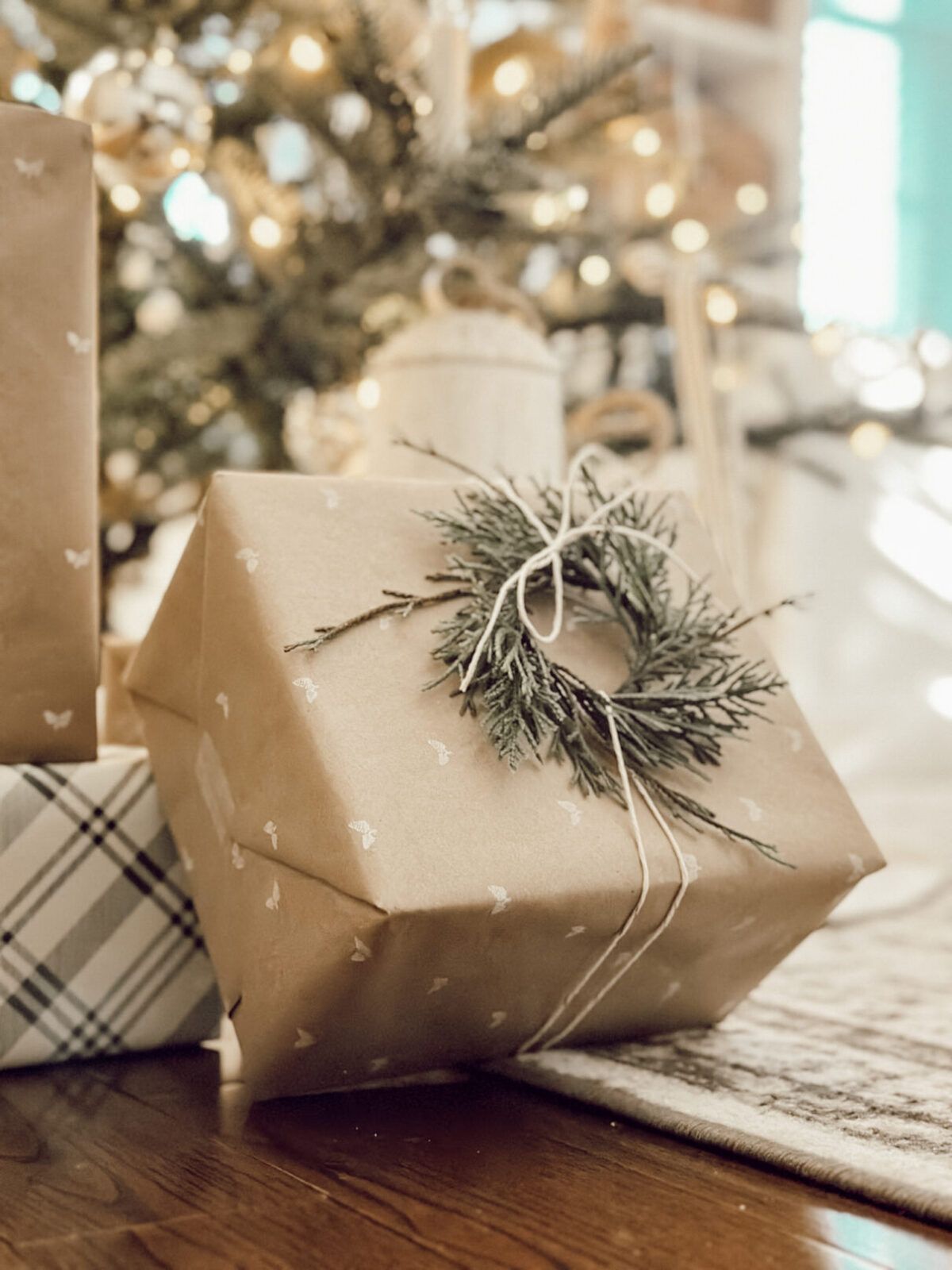 DIY custom wrapping paper made with brown paper, stamps, and a white ink pad.